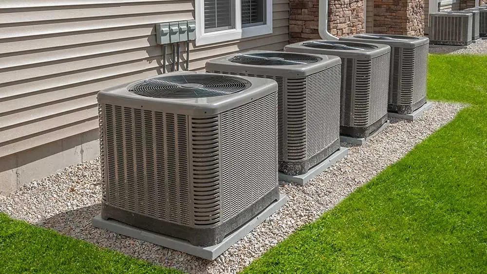 Row of outdoor AC condensers on pads